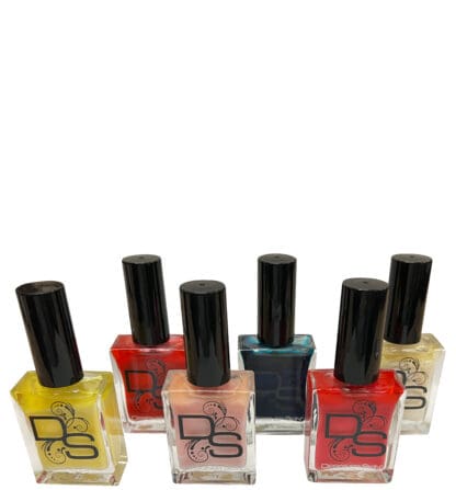 Six bottles of Designer Skin nail polish.