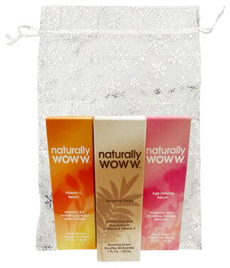 Three Naturally Woww skincare boxes in organza bag